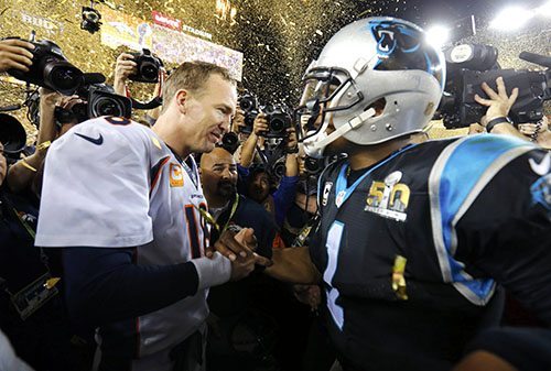 Denver Broncos' quarterback Manning and Carolina Panthers' quarterback Newton greet each other on the field after the Broncos defeated the Panthers in the NFL's Super Bowl 50 football game in Santa Clara
