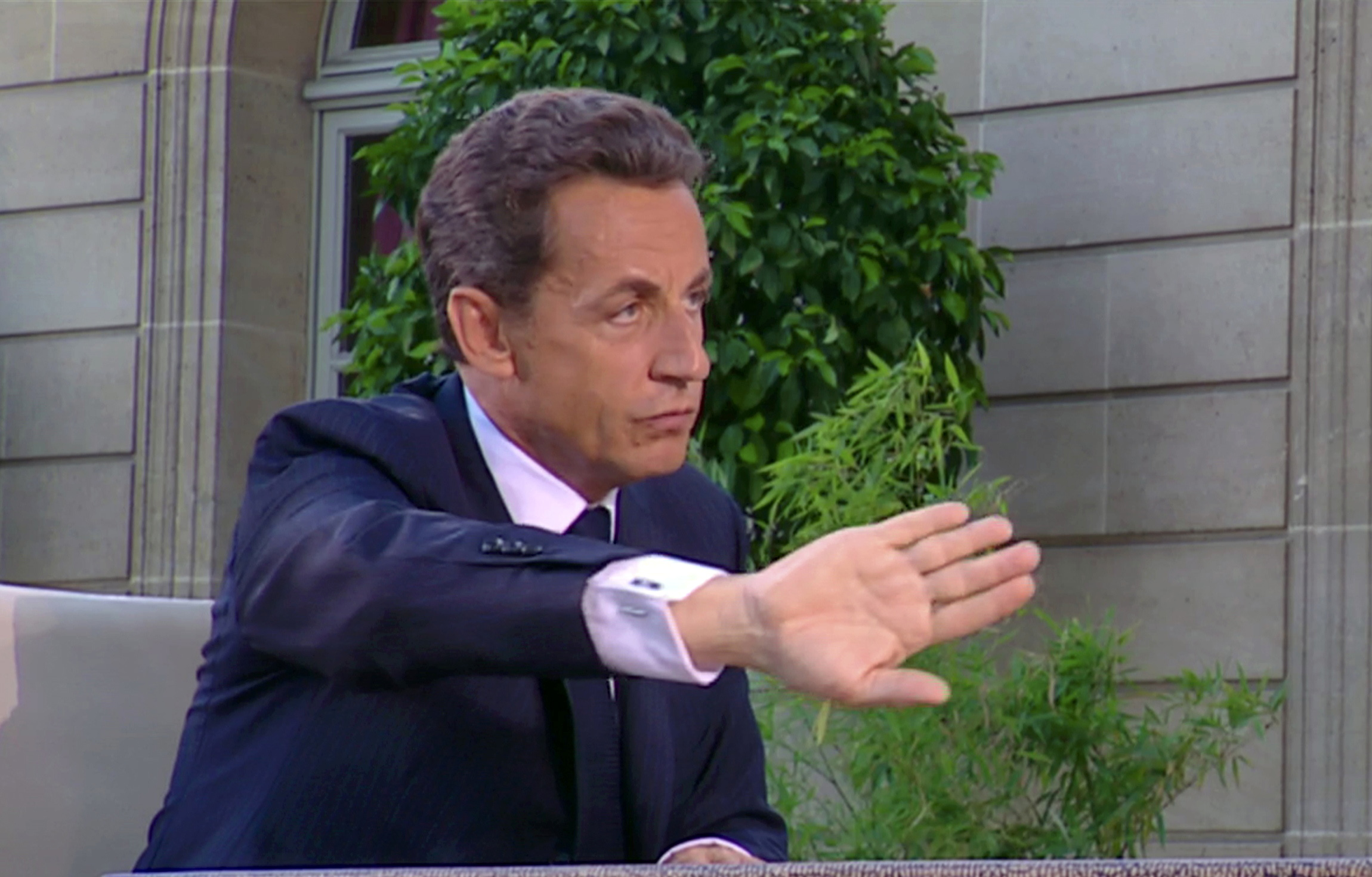 Sarkozy downplays Bettencourt scandal, exhorts French to work harder