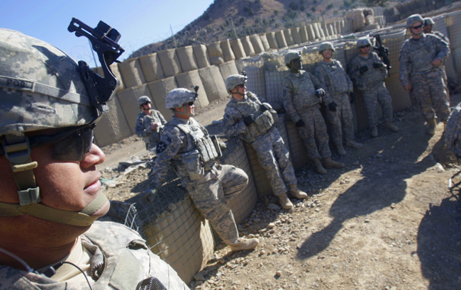 U.S. Army soldiers of A-BTRY 2/377 PFAR Task Force Steel wait to fire 105mm Howitzer during a training session at FOB Tillman