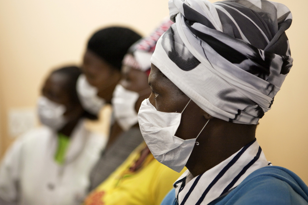 Patients with HIV and tuberculosis wear masks while awaiting consultation at a clinic in Cape Town's Khayelitsha township