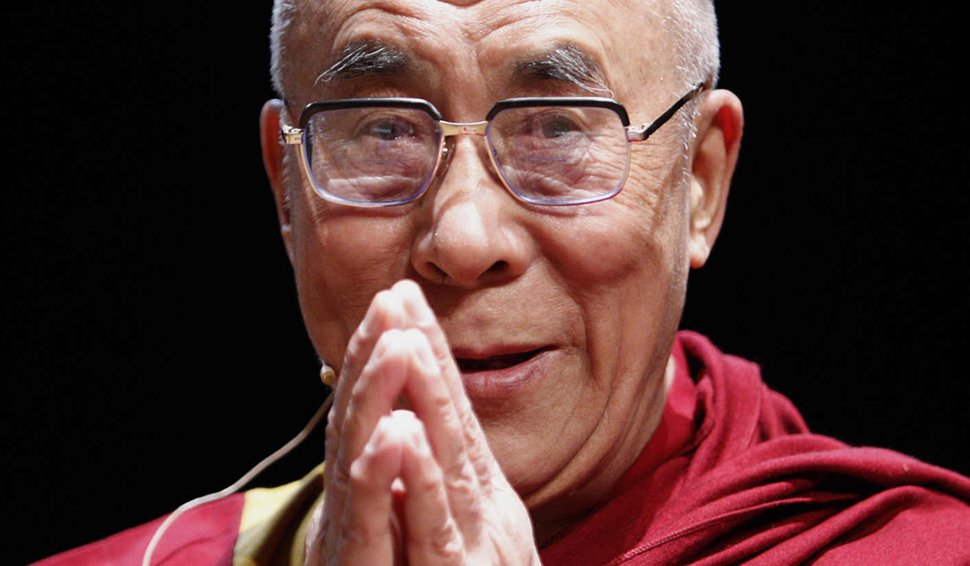 Dalai Lama greets participants as he arrives at the Mind and Life conference in Zurich