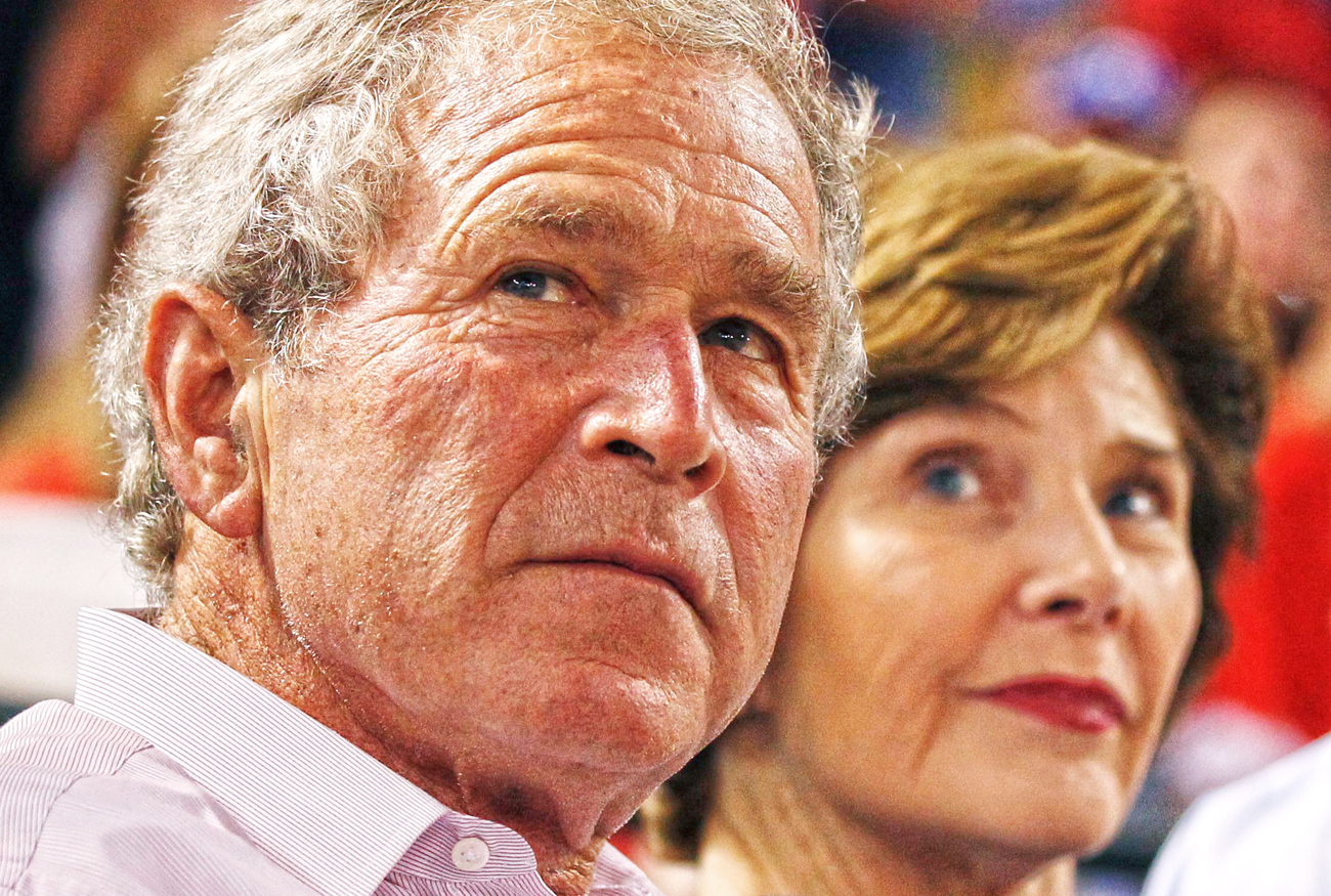 Former U.S. President George W. Bush and former first lady Laura Bush watch Game 1 of the MLB American League Championship Series baseball playoffs between the Detroit Tigers and the Texas Rangers in Arlington