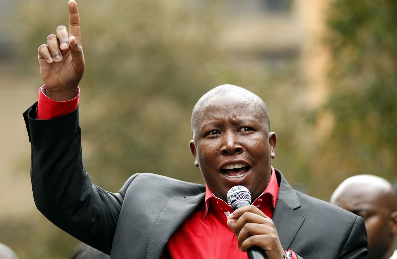 File photo of ANCYL President Julius Malema greeting his supporters during his appearance at the Johannesburg court for a hate speech trial