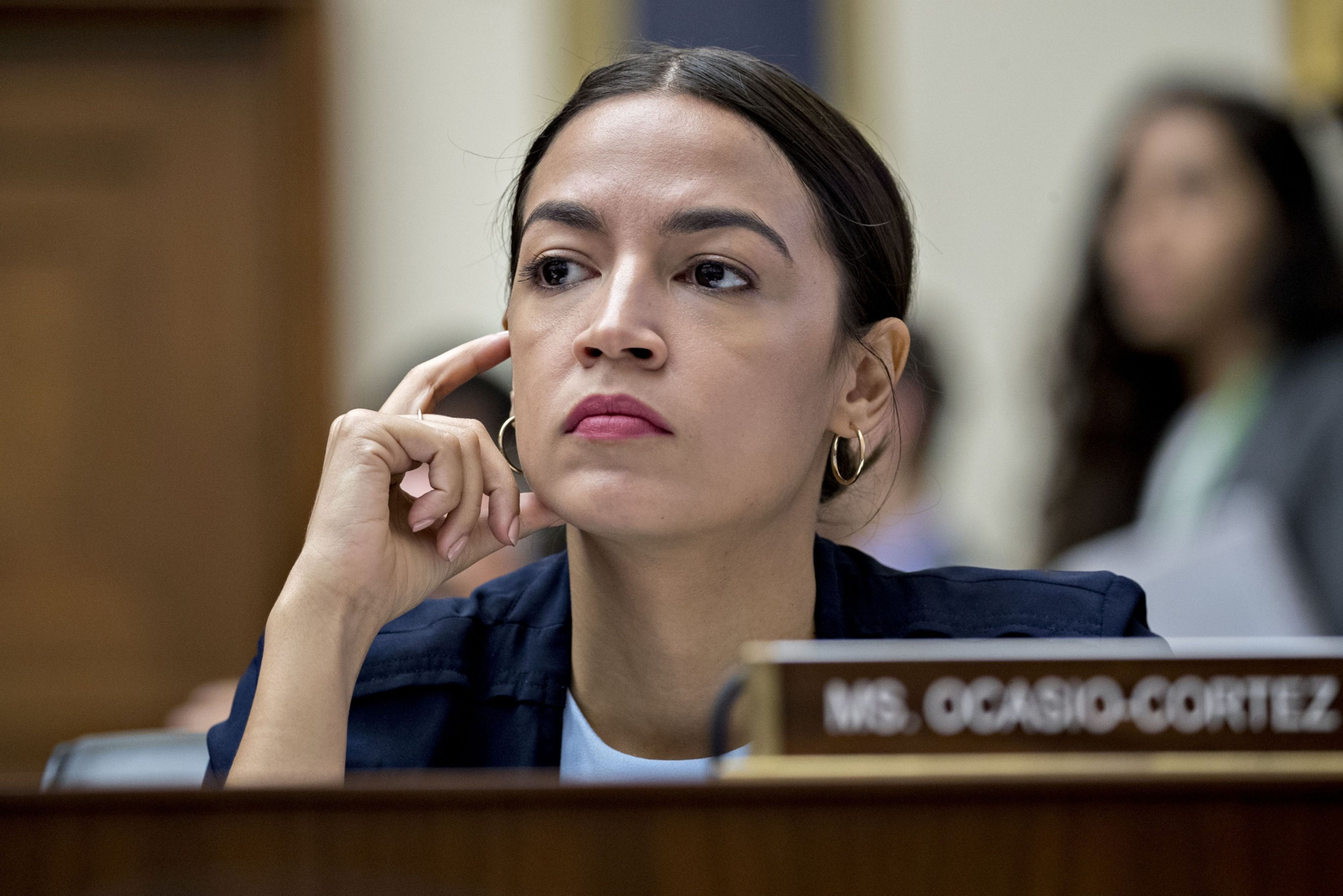 Ocasio-Cortez Urges Scrutiny of Robinhood Curbs on GameStop