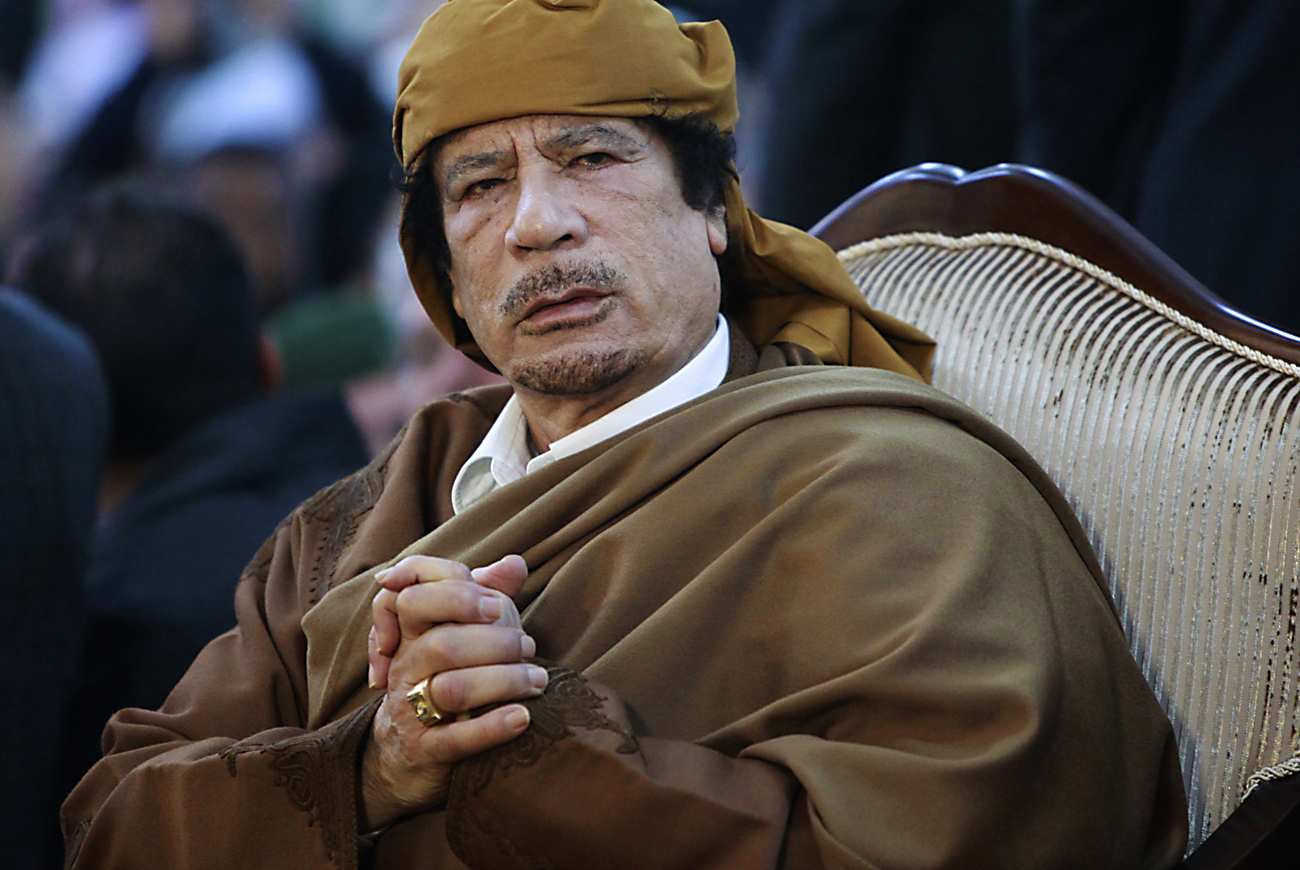 Libyan leader Muammar Gaddafi attends a ceremony marking the birth of Islam's Prophet Mohammed in Tripoli