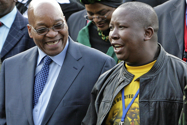 Zuma, leader of South Africa's ruling ANC, chats with Malema, president of ANCYL, at the Pietermaritzburg high court outside Durban