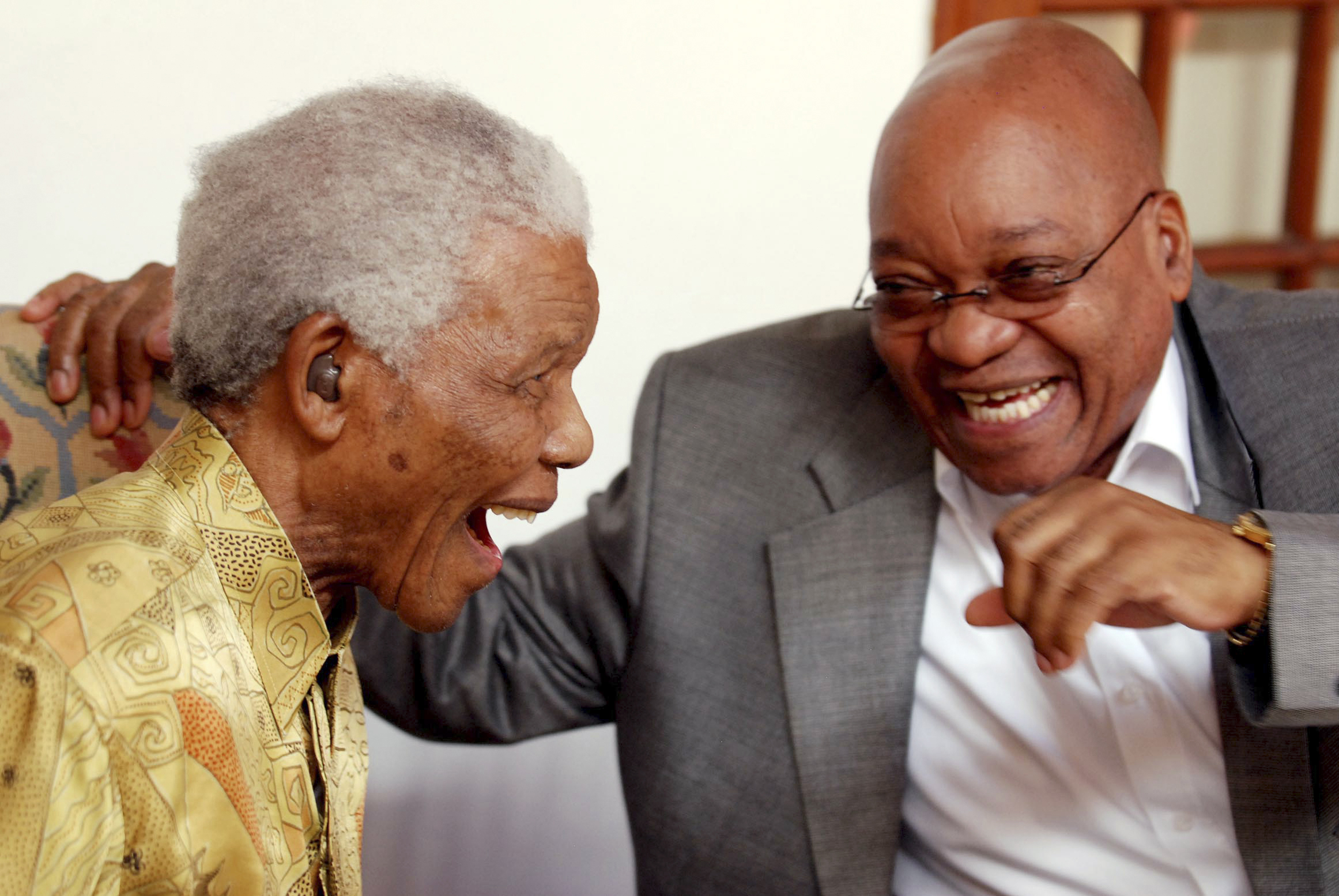 Former South African president Mandela is greeted by South African president  Zuma at a lunch meeting in Cape Town