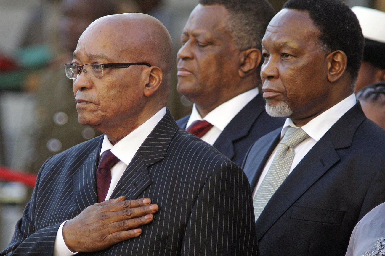 South African President Jacob Zuma and Deputy President Kgalema Motlanthe take a salute before his State of the Nation address at Parliament in Cape Town