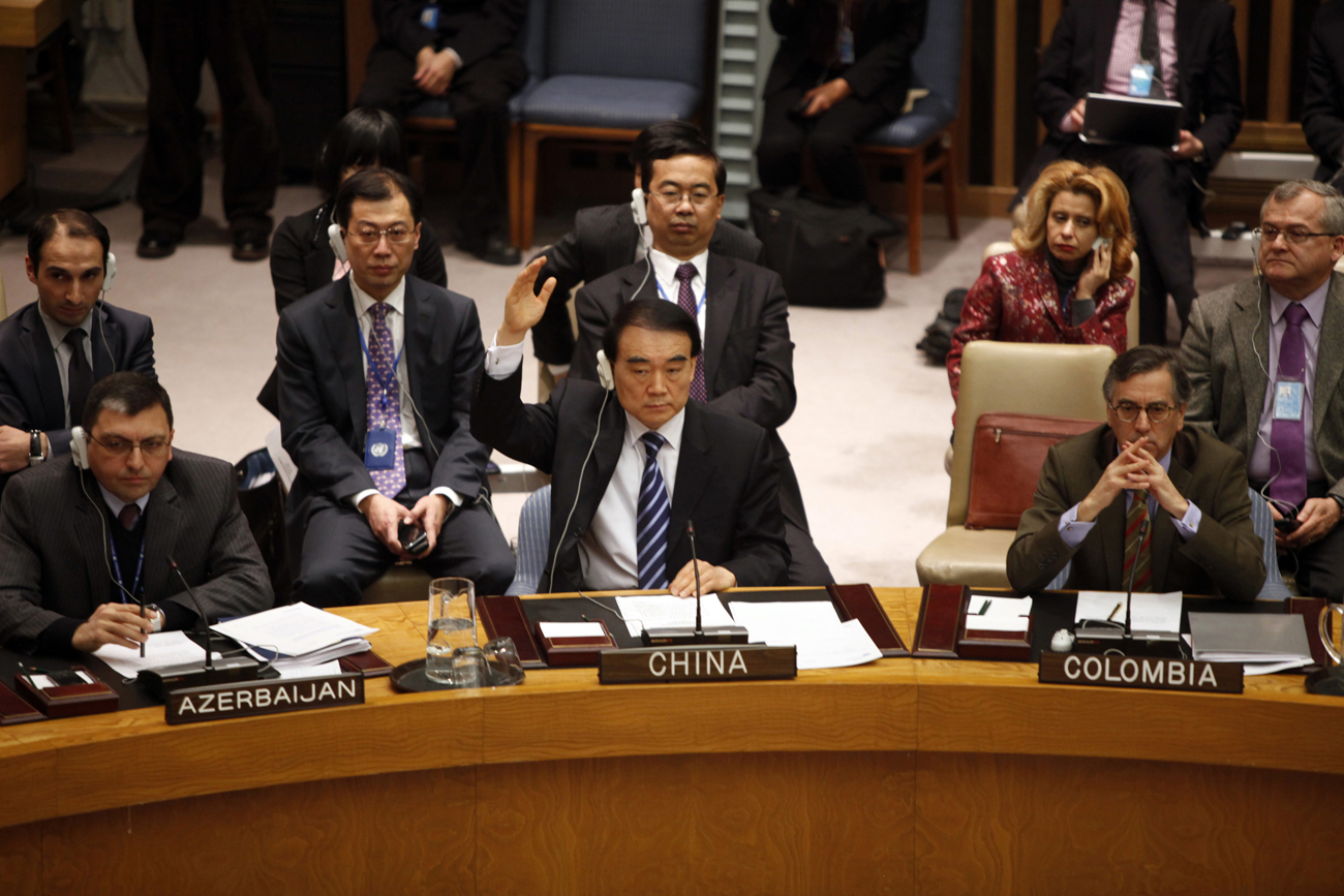 China's Ambassador Li votes during a U.N. Security Council meeting in New York