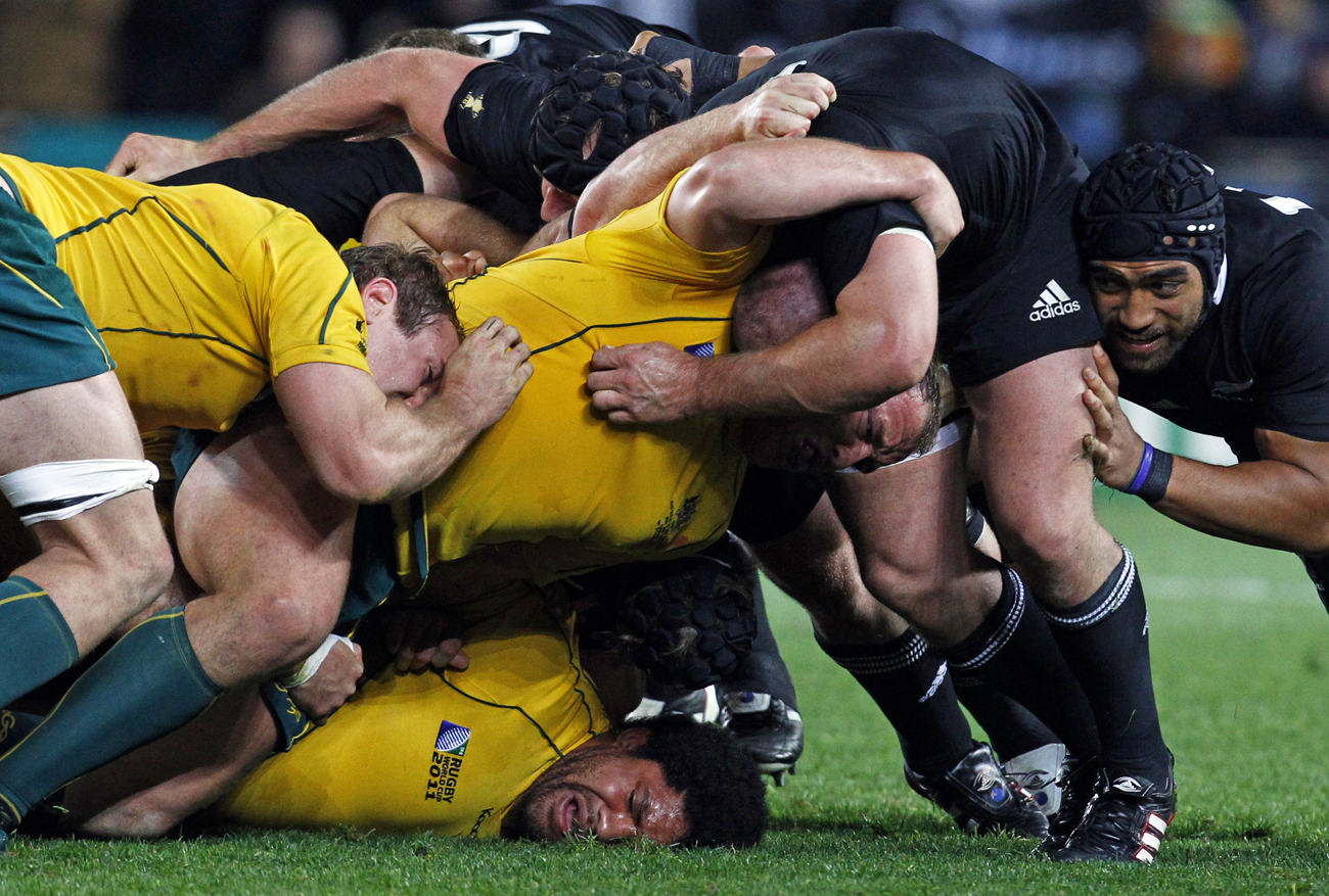 Australia Wallabies and New Zealand All Blacks players contest a scrum during their Rugby World Cup semi-final match at Eden Park in Auckland