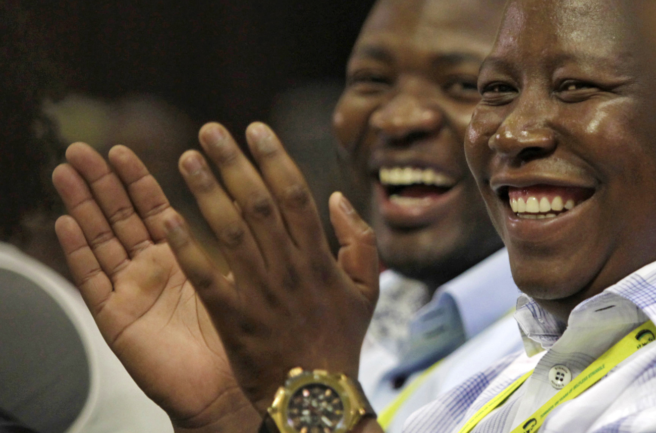 African National Congress Youth League leader Julius Malema listens as President Jacob Zuma delivers the closing address at the National General Council of his ruling African National Congress