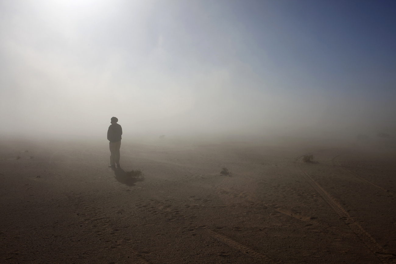 A Sahrawi man stands in the Sahara desert between Tindouf and Tifariti