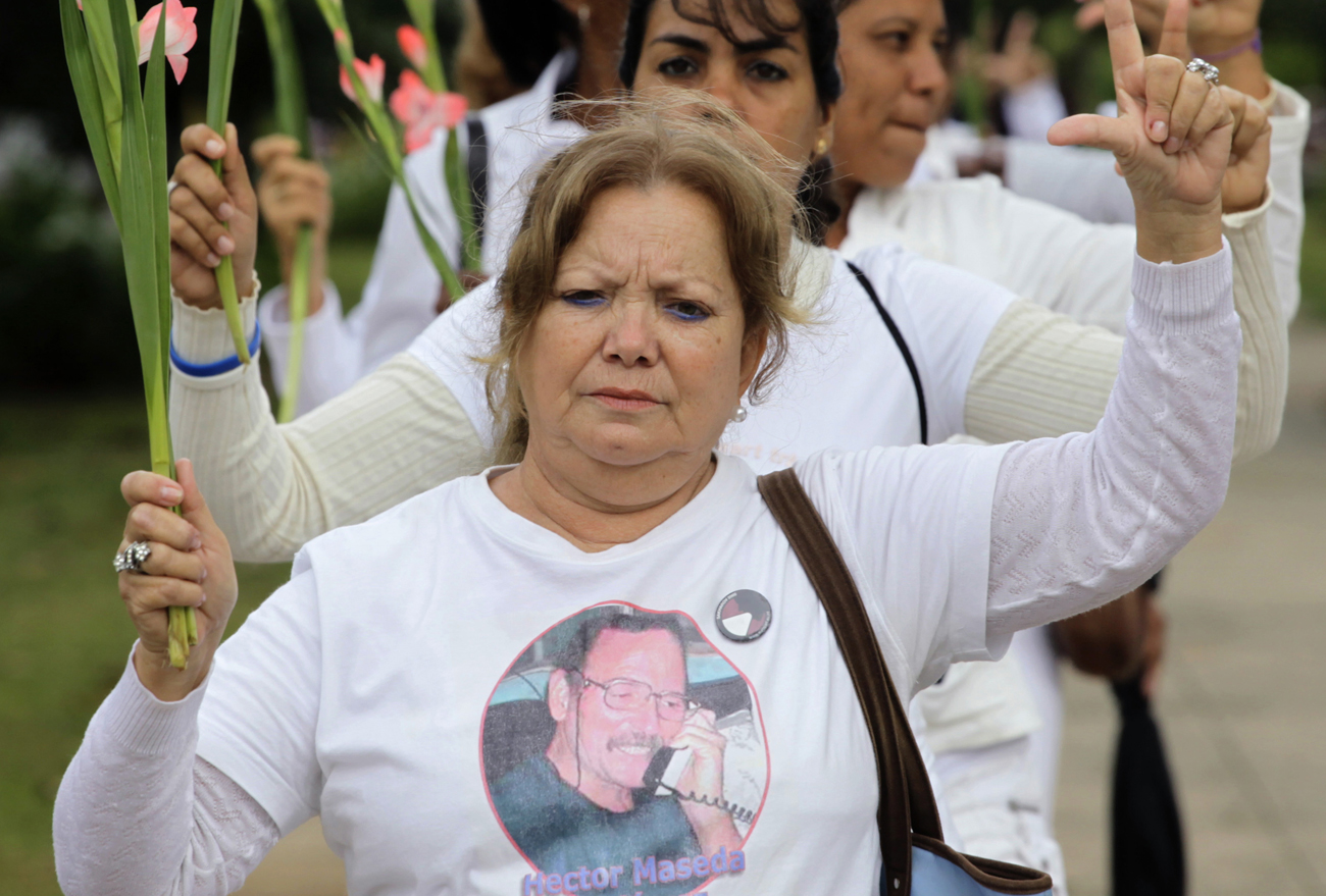 Laura Pollan, leader of The Ladies in White, marches during their weekly protest in Havana