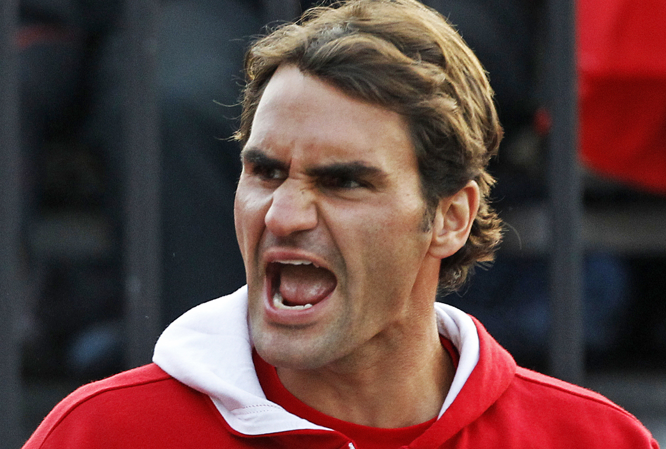 Federer of Switzerland reacts during the Davis Cup World Group play-off tennis match between his compatriot Wawrinka and Hewitt of Australia in Sydney