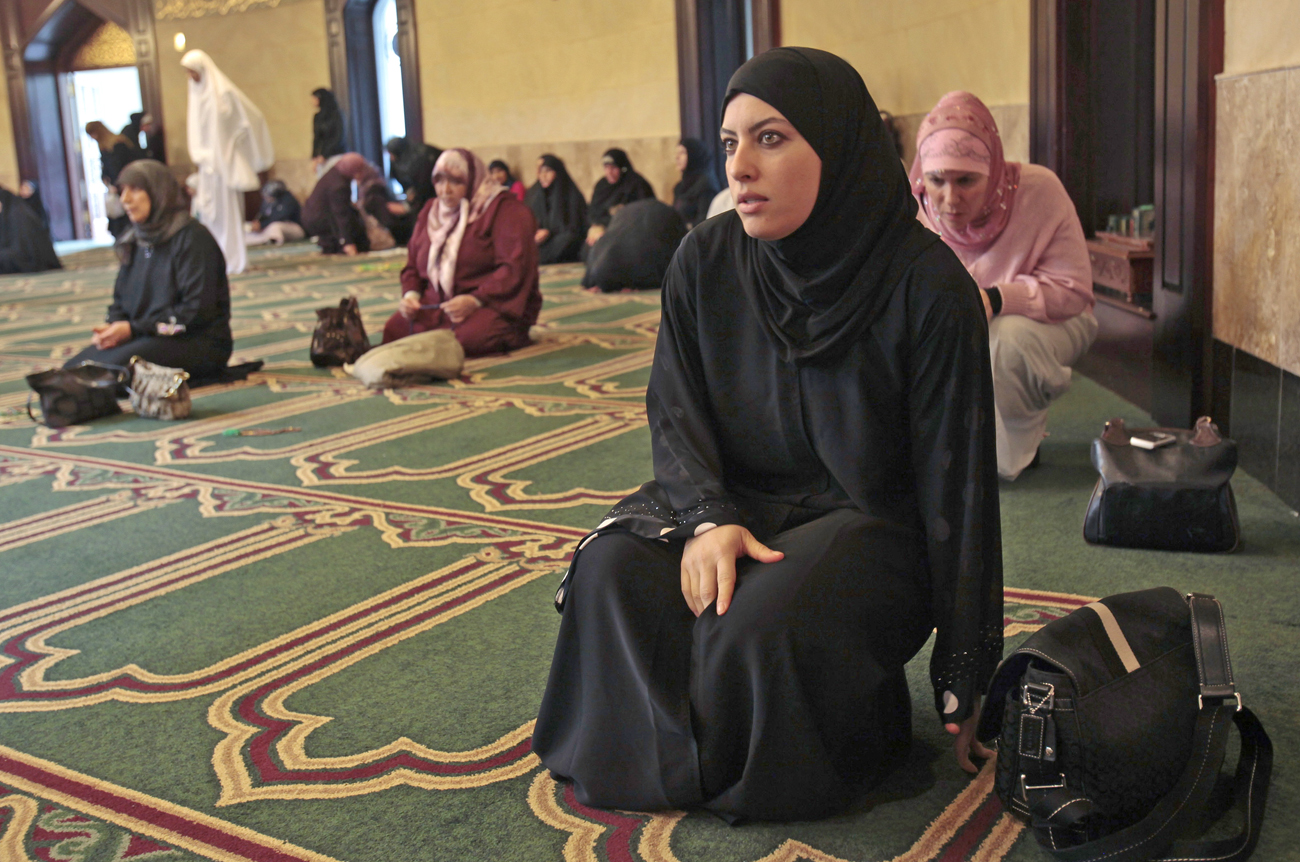 Lamis Ali, 29, arrives for afternoon prayers at the Islamic Center of America in Dearborn