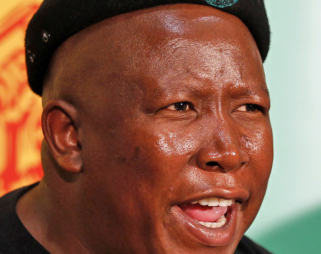 Suspended ANCYL president Malema gestures as his secretary-general Magaqa looks on during a media briefing at the party's headquarters in Johannesburg