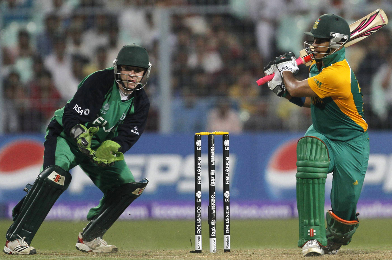 South Africa's Duminy plays a shot as Ireland's wicketkeeper O'Brien watches during their ICC Cricket World Cup group B match in Kolkata