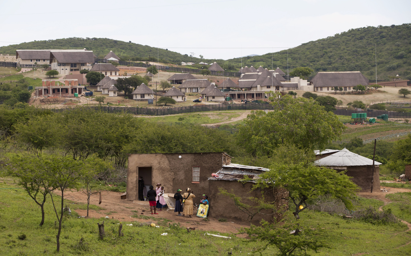 Supporters of South Africa's President Jacob Zuma prepare to prevent DA members from walking towards Zuma's house in Nkandla