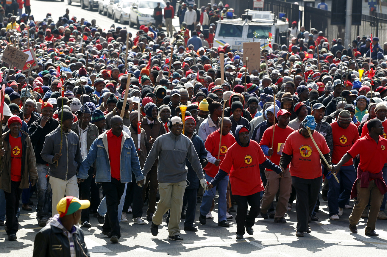 Workers take part in a march in the city of Johannesburg