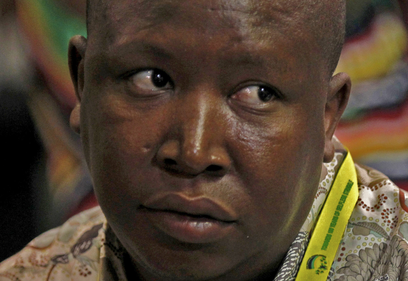 African National Congress Youth League leader Julius Malema listens as South Africa's President Jacob Zuma speaks in Durban