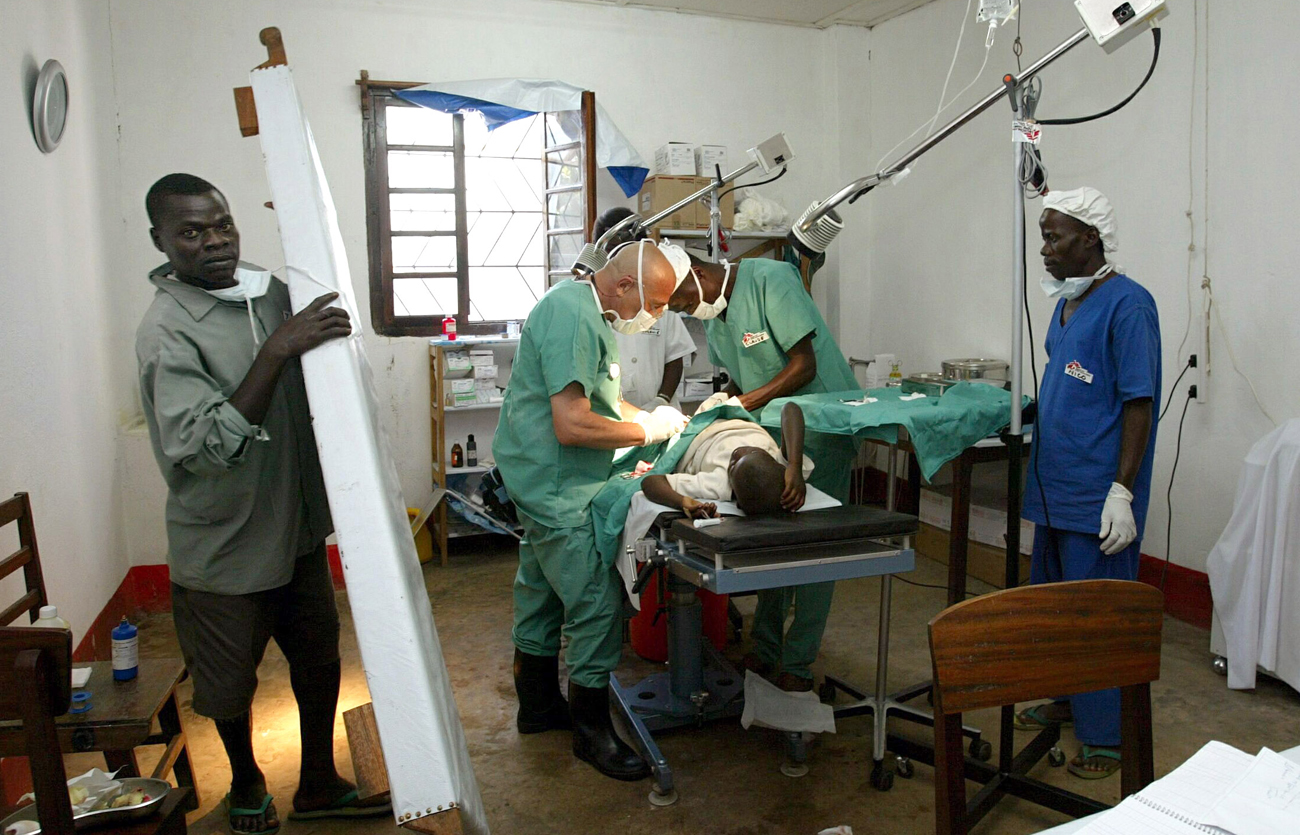 DOCTORS PERFORM SURGERY ON A YOUNG BOY IN A HOSPITAL IN THE NORTHEASTOF THE DEMOCRATIC REPUBLIC OF CONGO.
