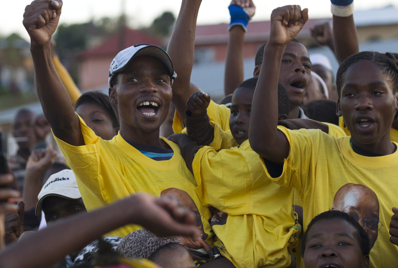 Supporters greet South African President Zuma as he campaigns in Richmond