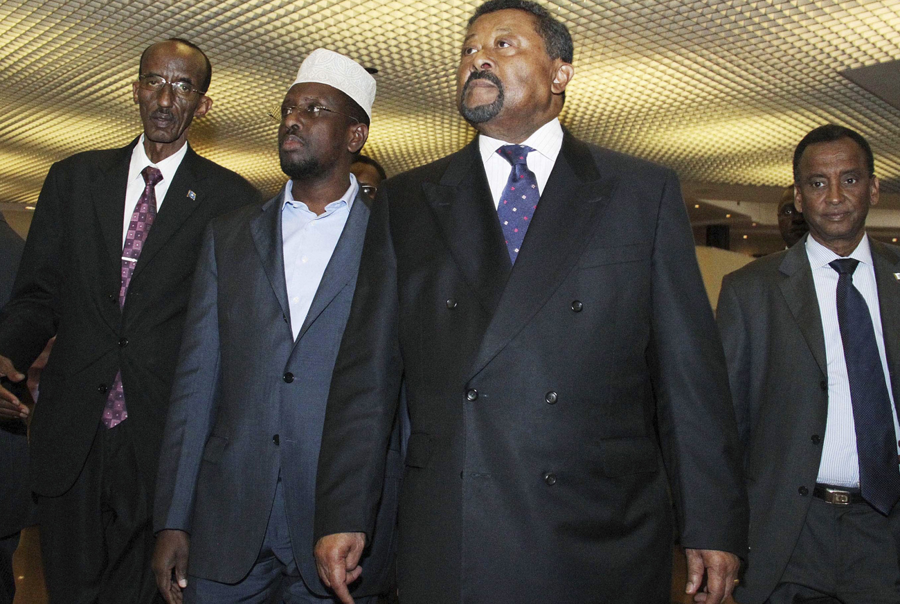 African Union Commission chairman Jean Ping and Somalia's President Sheikh Sharif Ahmed arrive at the Africa Union summit in Ethiopia's capital Addis Ababa