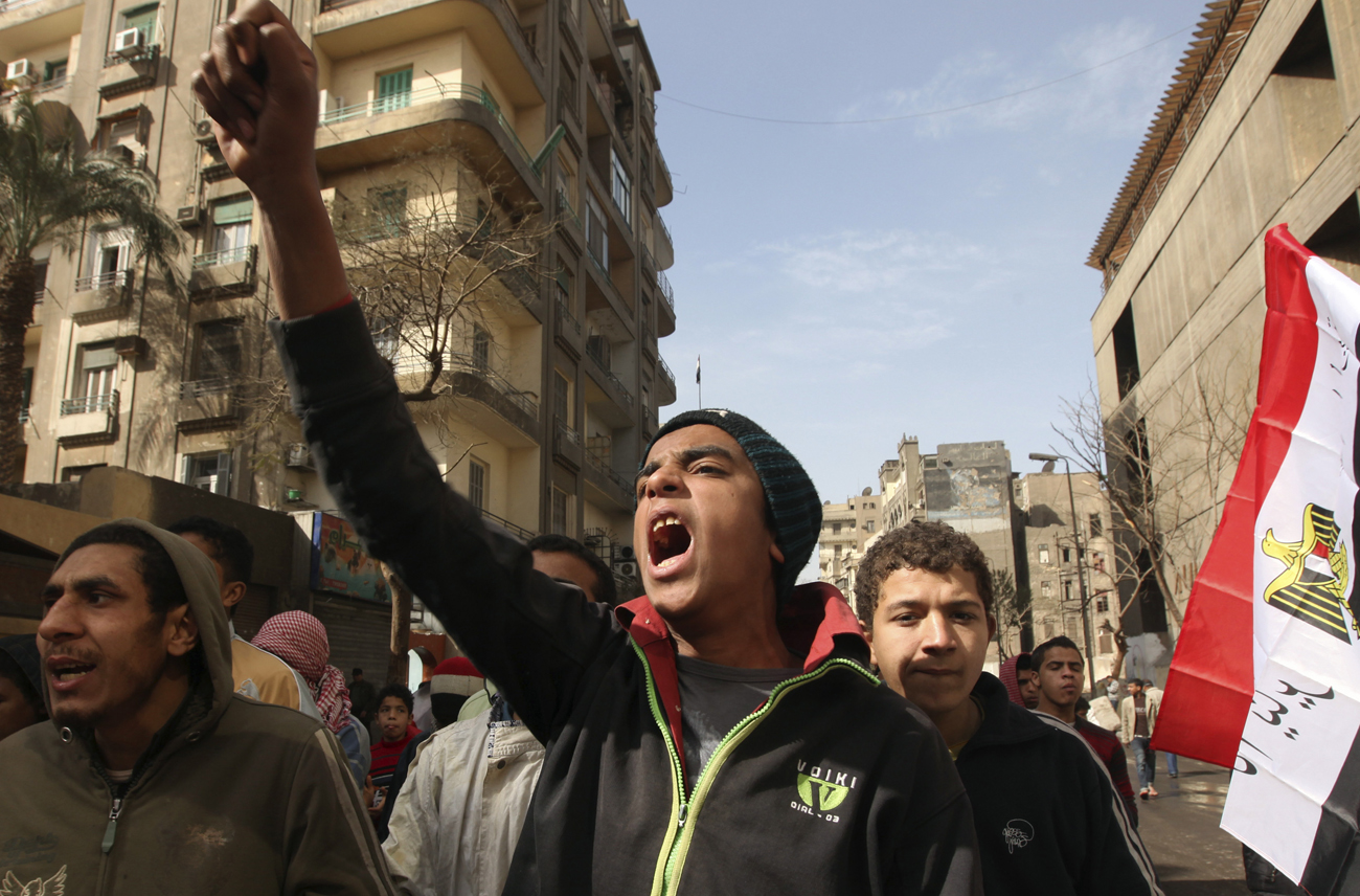 A protestor chants anti-military council slogans during a protest against the ruling military council near Tahrir square in Cairo