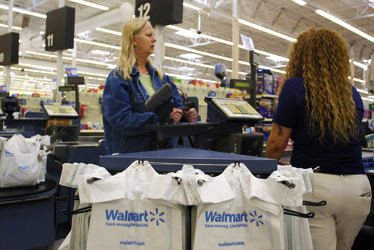 A woman waits in the check-out lane at Wal-Mart in Phoenix, Arizona