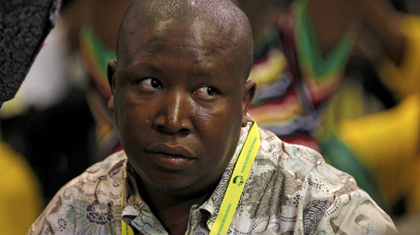 African National Congress Youth League leader Julius Malema listens as South Africa's President Jacob Zuma speaks in Durban