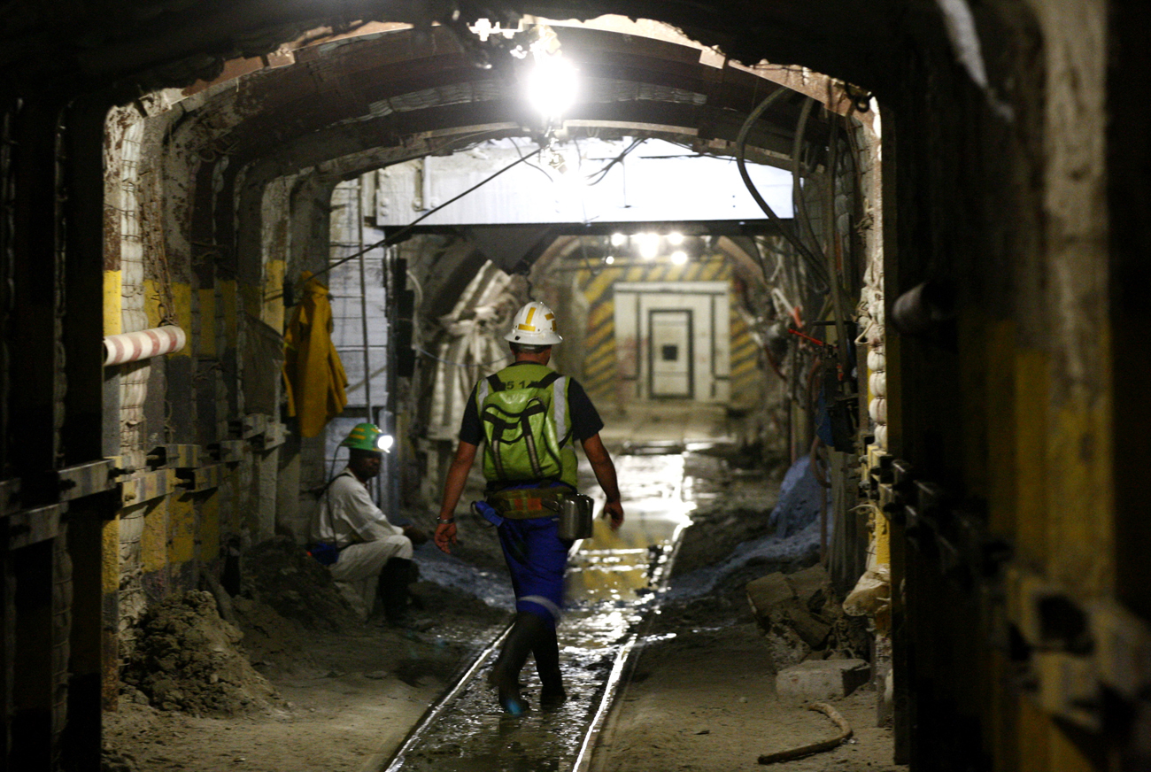 A mine worker walks underground in South Deep mine outside Johannesburg