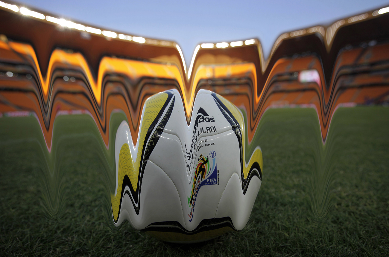 A replica of the Jabulani match ball is seen on the pitch during a test match of youth teams at the Soccer-City stadium in Johannesburg