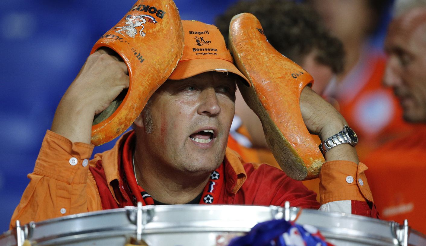 A Netherlands fan reacts after Netherlands lost their Group B Euro 2012 soccer match against Portugal at Metalist stadium in Kharkiv