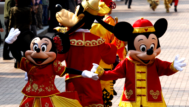 Characters at Hong Kong Disneyland greet visitors after a parade celebrating the upcoming Year of Ox