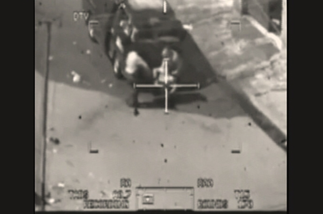 This image captured from a classified U.S. military video footage shows a wounded Iraqi person being loaded onto a van in Baghdad