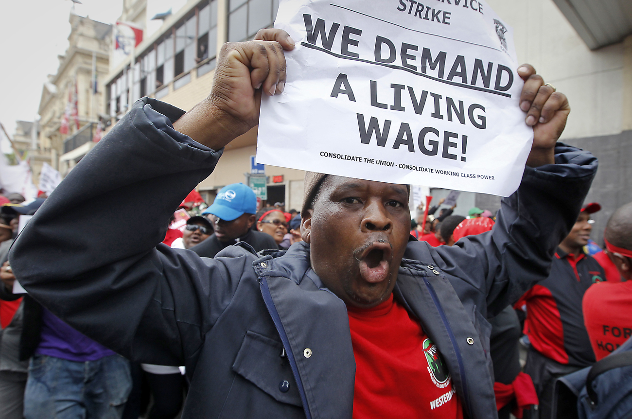 Striking South African public service workers march through the streets of Cape Town