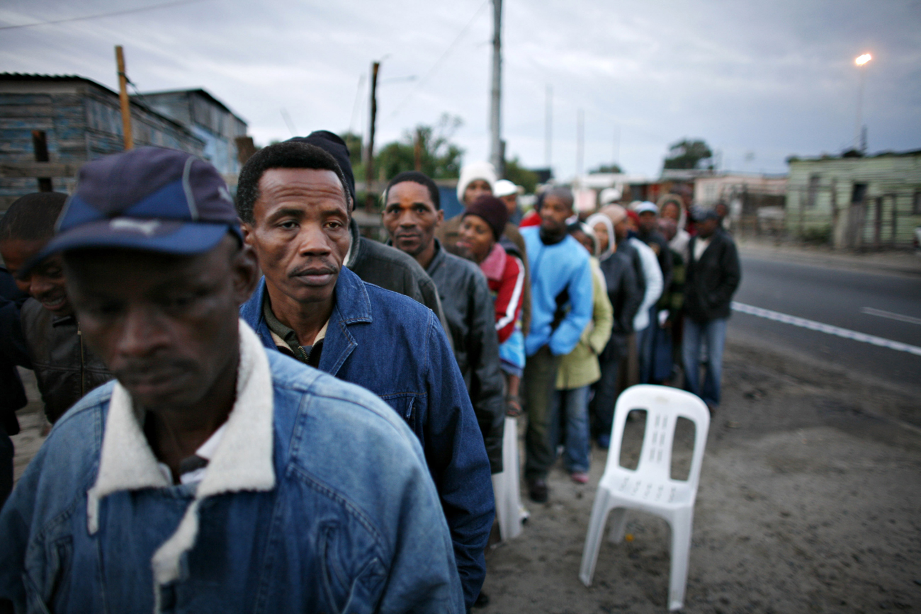 South Africans wait to vote outside a polling station in Cape Town's Khayelitsha township