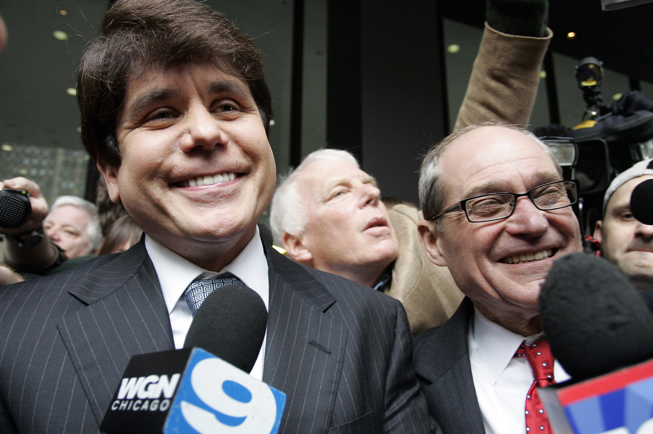 Blagojevich smiles as he and his attorney leave federal court in Chicago