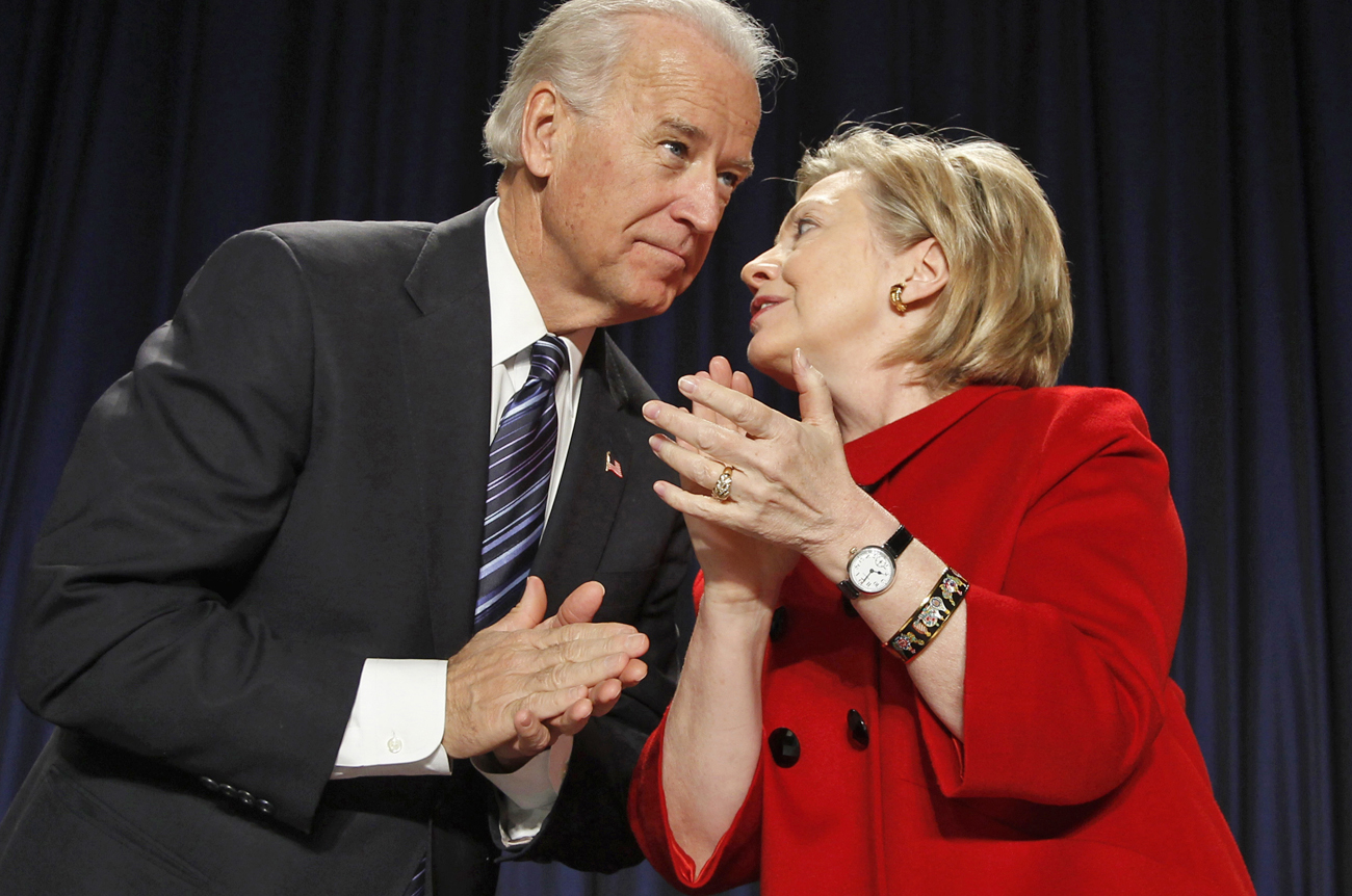 US Vice President Biden listens to Secretary of State Clinton in Washington