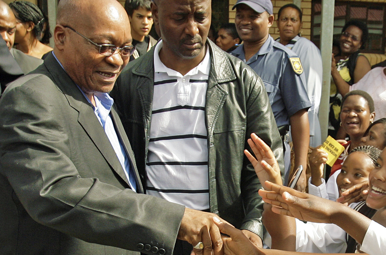 African National Congress president Jacob Zuma greets pupils at  Bhukulani secondary school  in Soweto