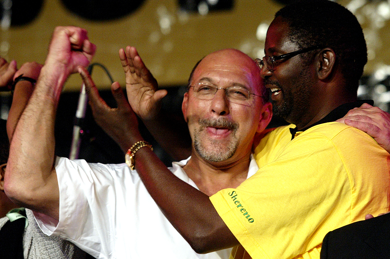 SOUTH AFRICAN FINANCE MINISTER TREVOR MANUEL CELEBRATES WITH TRADE UNIONIST ZWELINZIMA VAVI AT ...