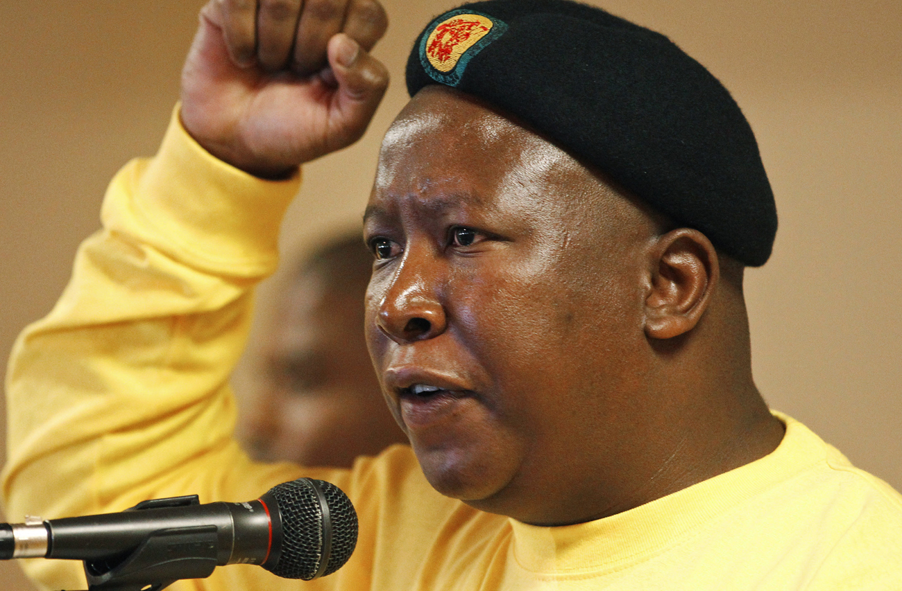 Suspended ANC Youth League President Julius Malema gestures as he sings during their annual conference in Pretoria