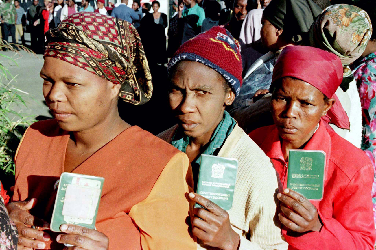 Residents of this black township south of Durban queue outside a polling station, June 26. South Afr..
