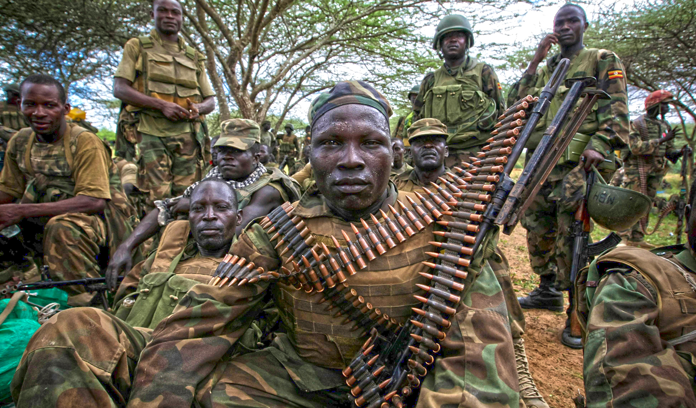 Ugandan soldiers serving with the African Union Mission in Somalia (AMISOM), listens in Afgoye