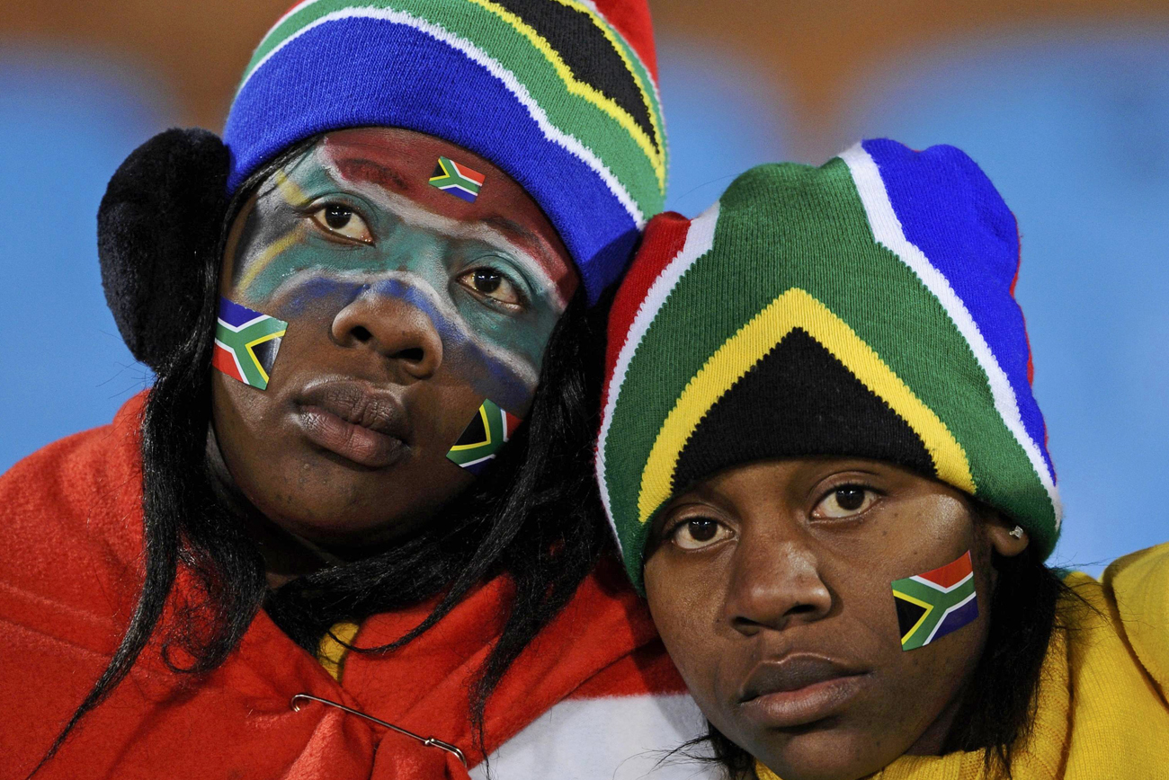 South Africa fans react after their team lost to Uruguay following  their 2010 World Cup Group A soccer match at Loftus Versfeld stadium in Pretoria