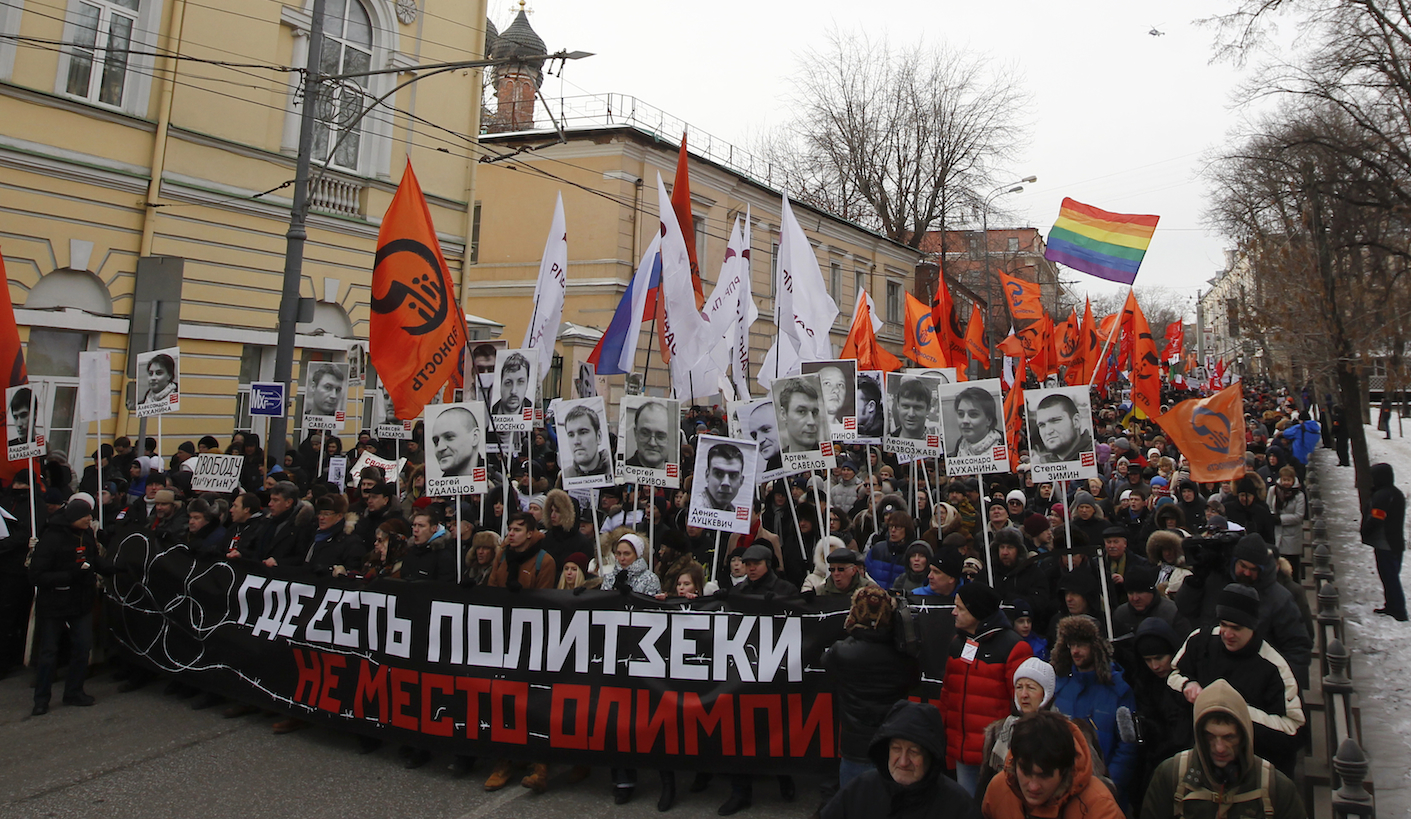 People march during an opposition rally in Moscow