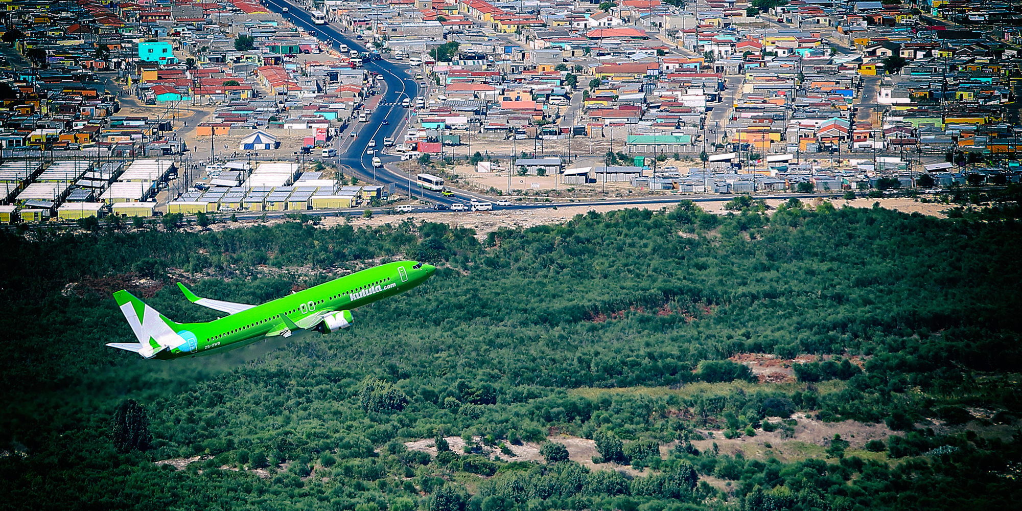 Aerial photo of Kulula taking off from Cape Town International Airport, Cape Town, Western Cape, South Africa