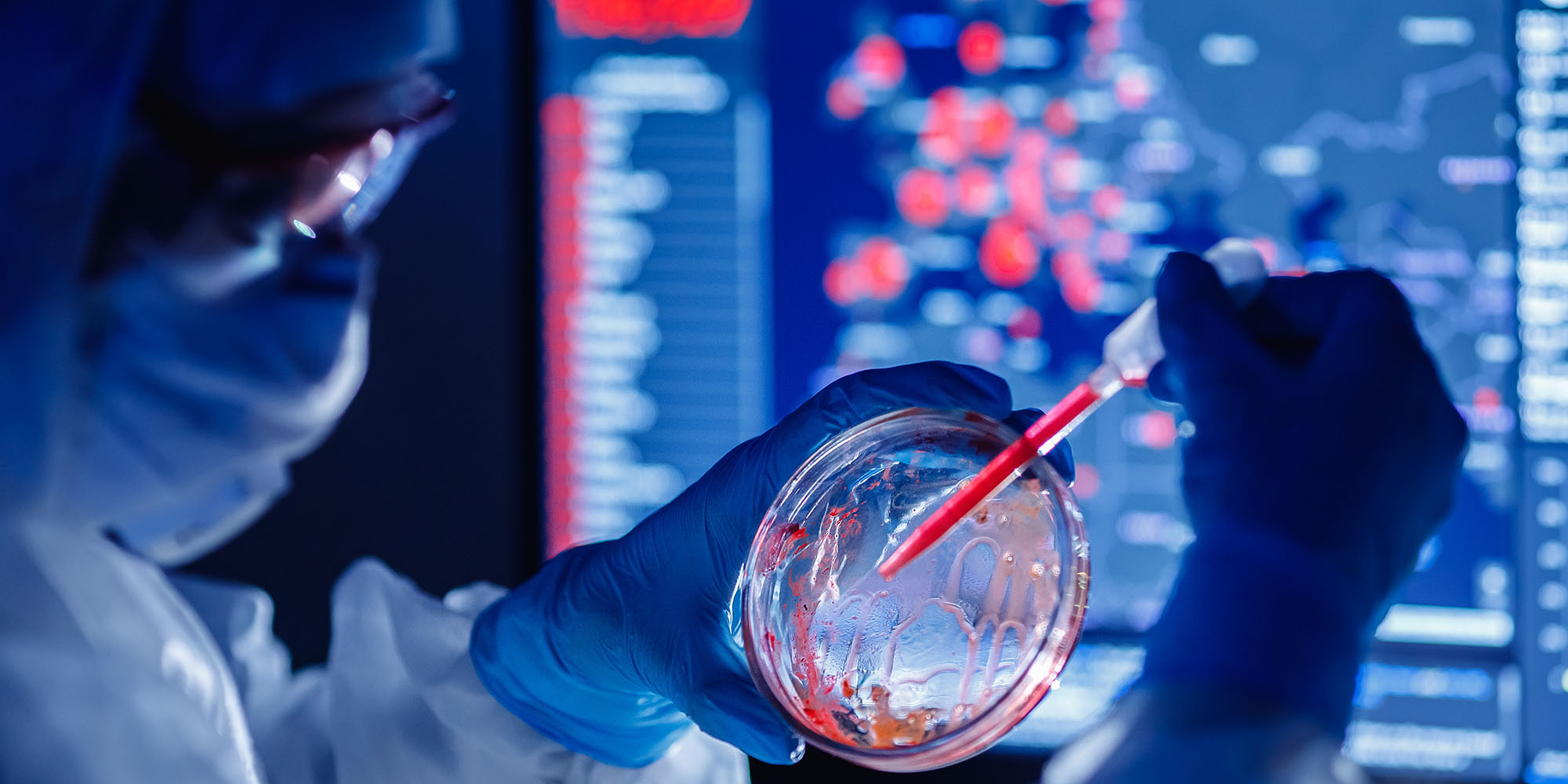 Medical bioengineer working on development vaccines 2019-ncov coronavirus in pharmacy laboratory. Blue colour background