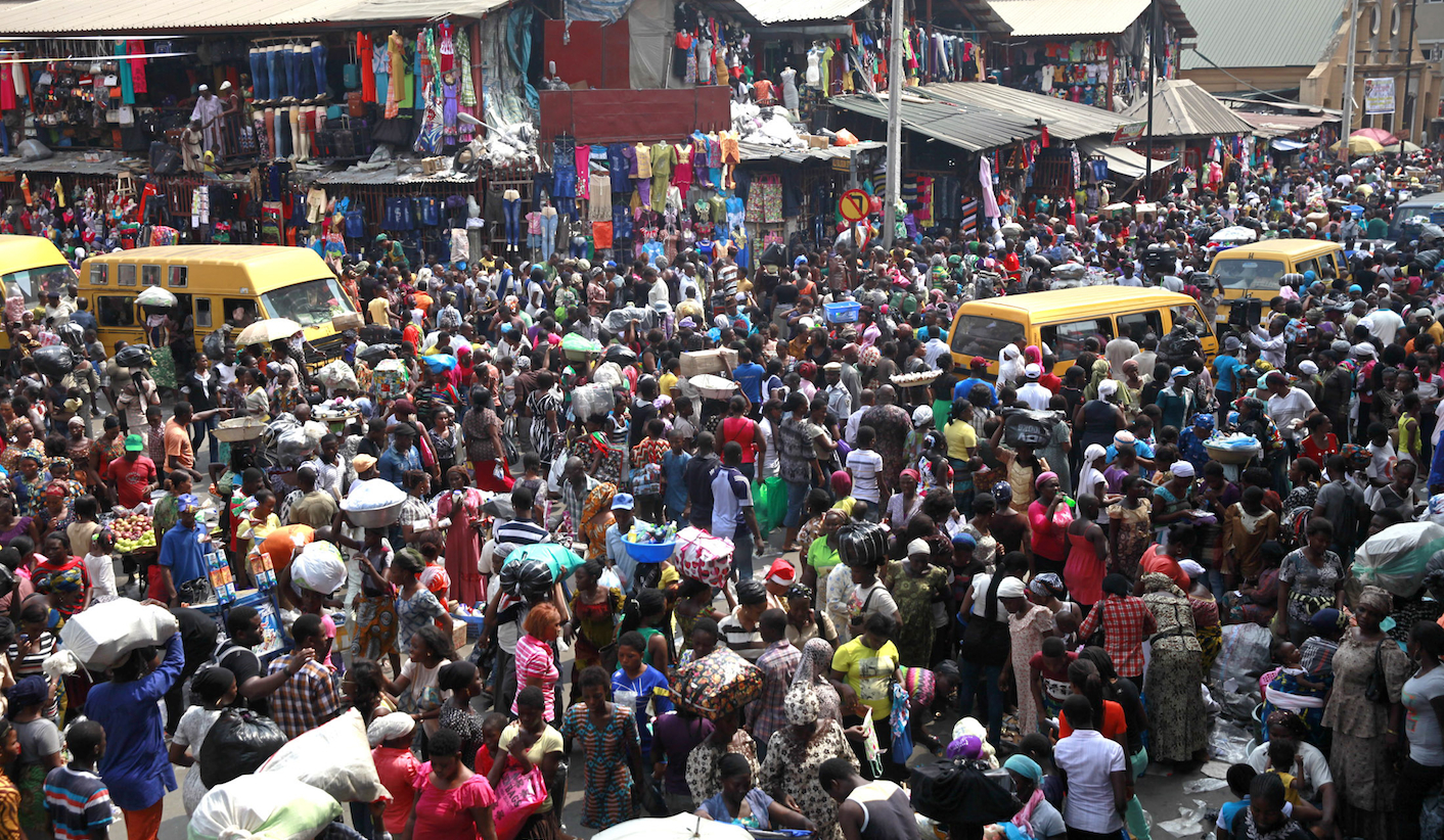 People gather at Balogun market two days before Christmas in central Lagos