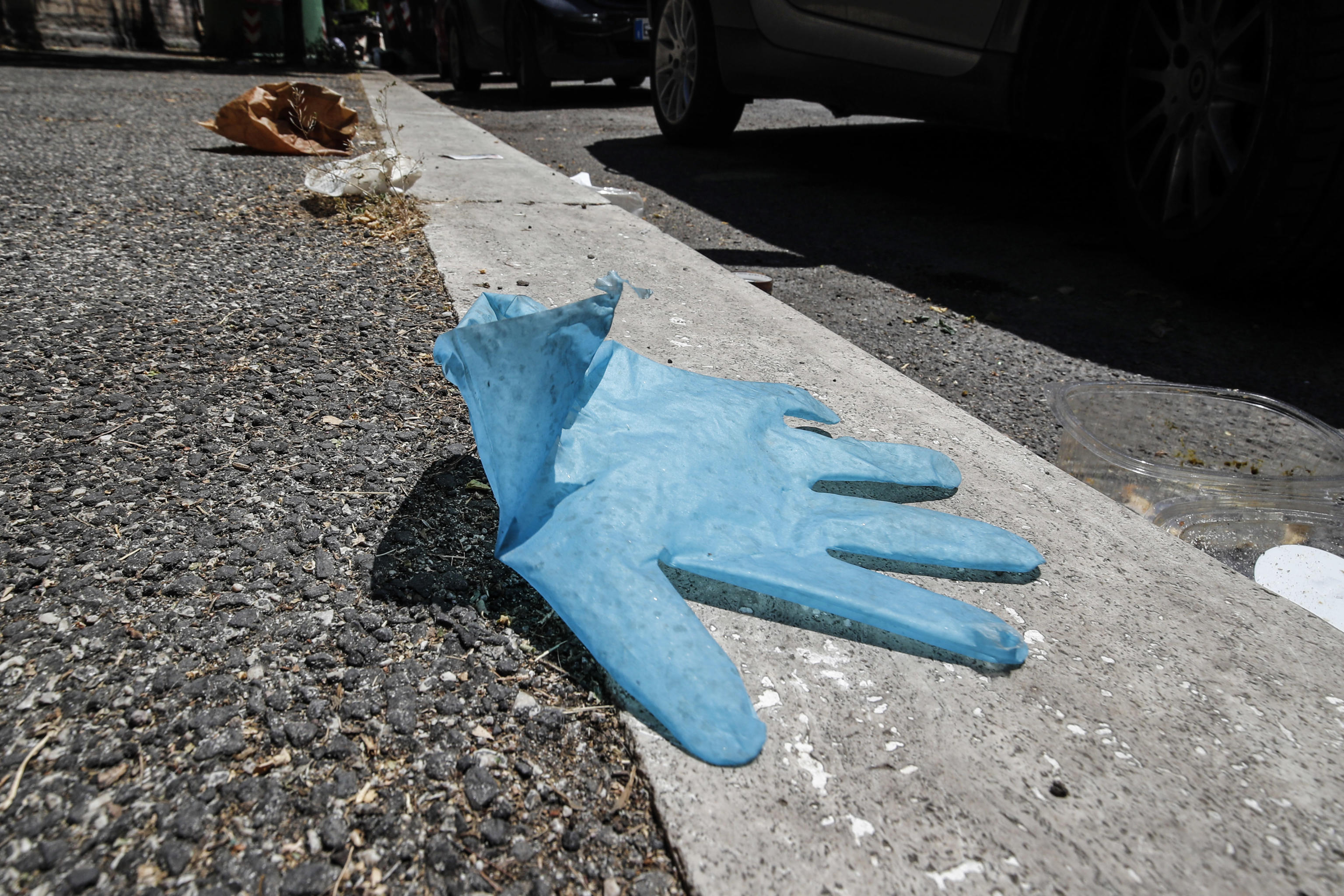 Discarded latex gloves and protective face masks